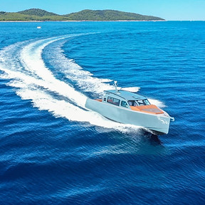 Professional skipper navigating a speedboat through the Adriatic near Hvar